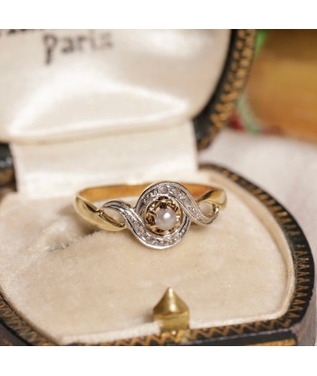 Bague tourbillon deux ors perle et diamants rembourrage situé sous