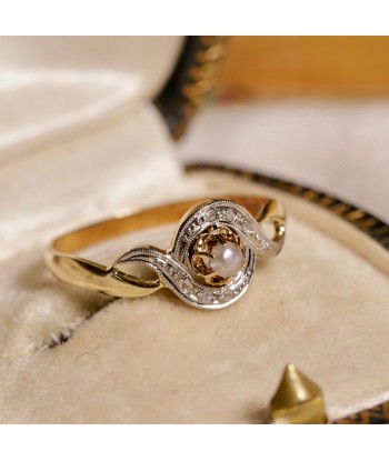 Bague tourbillon deux ors perle et diamants rembourrage situé sous