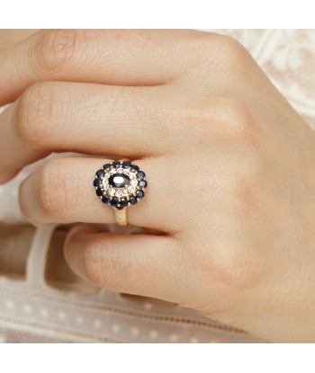 Bague marguerite diamants et saphirs hantent personnes